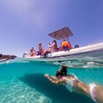 zadar boat tour girl diving below speedboat