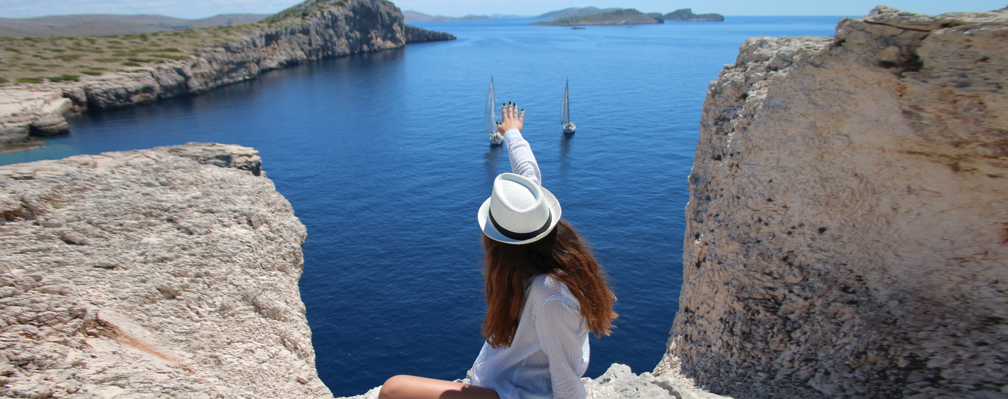 kornati islands and telašćica private boat tour girl on a cliff enjoying view
