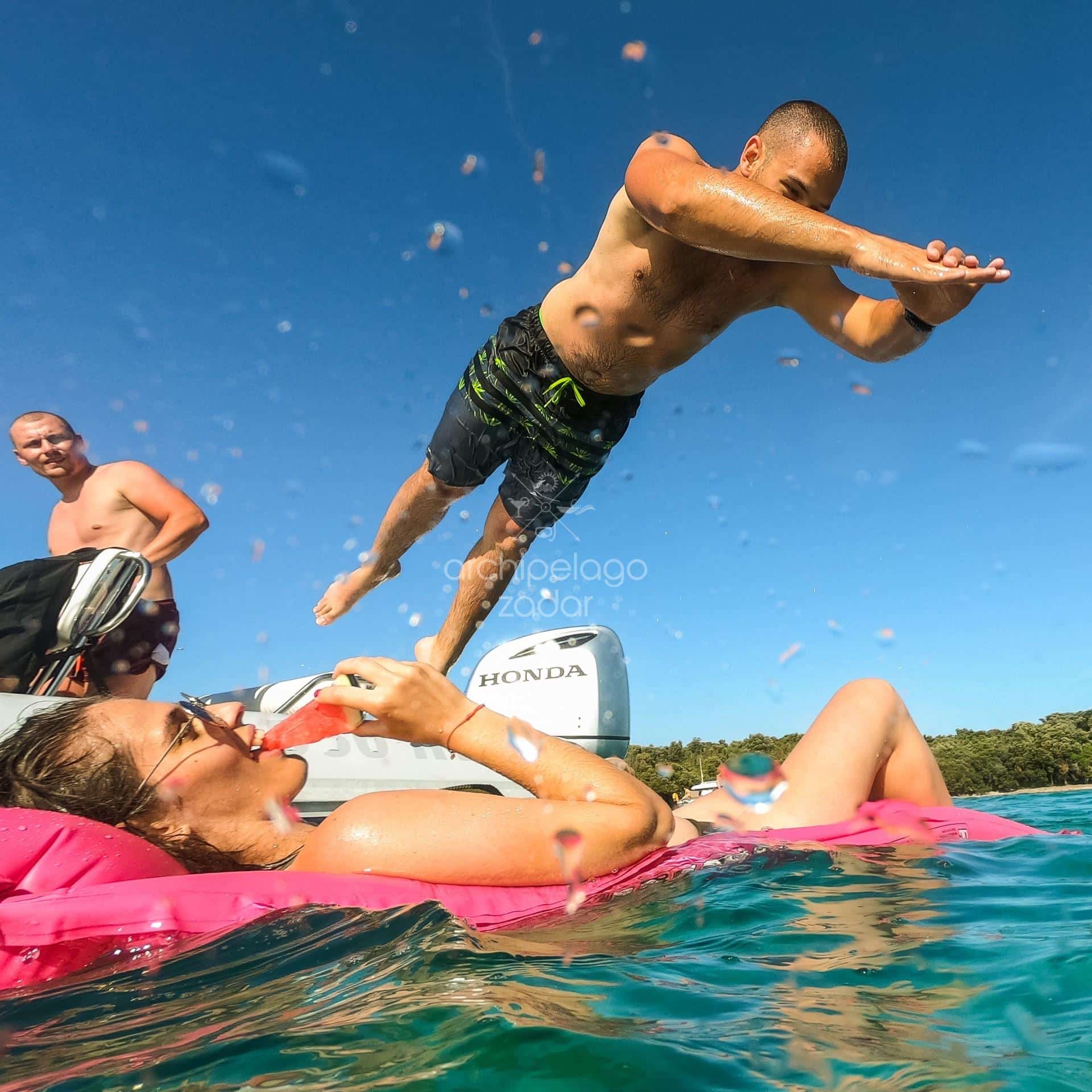 silba and olib best family-friendly boat tour activities, relaxing on a floatie and boat jumps