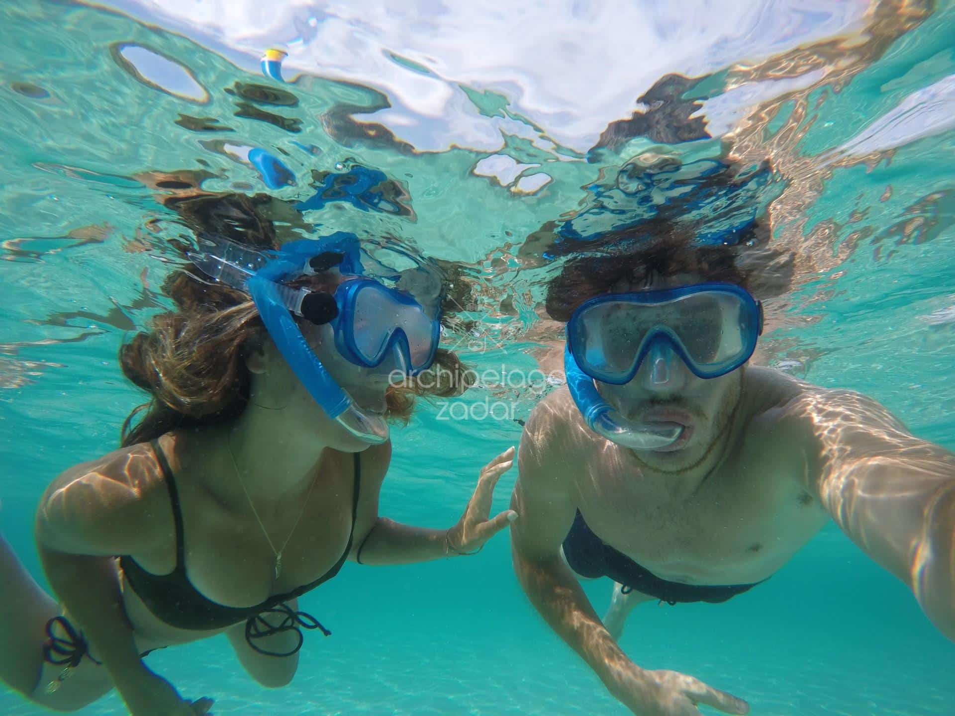 two people snorkeling in zadar archipelago