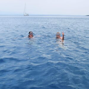 people swimming and snorkeling molat