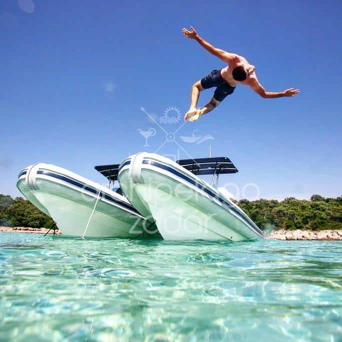 A backflip done from a bow of a speedboat