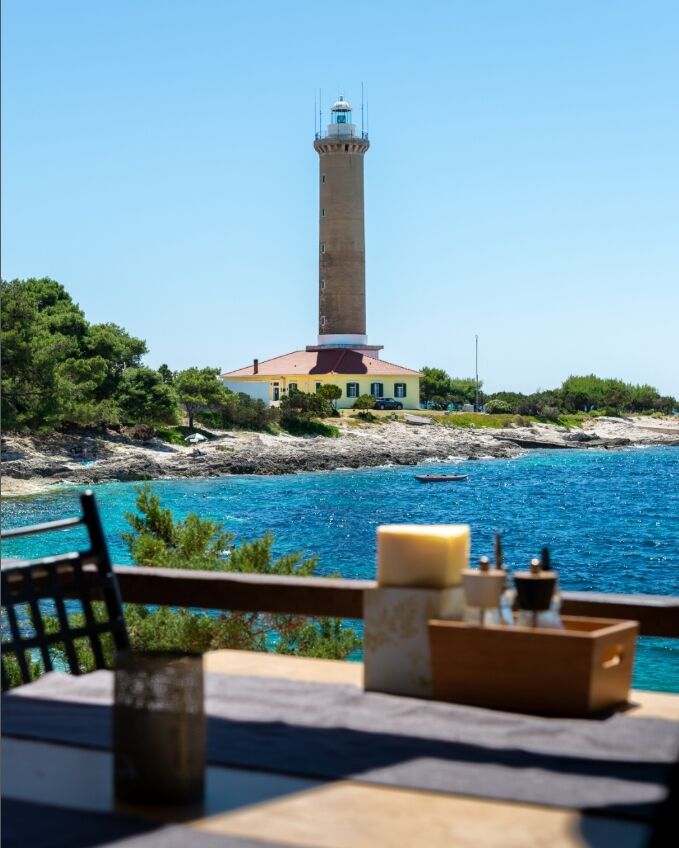Momi Restaurant Dugi otok on a boat trip with Zadar Archipelago lighthouse